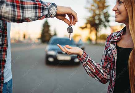 Student receiving car keys after earning driving independence